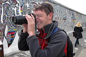 UF photojournalism student David Gardner takes pictures at one of the remaining segments of the Berlin Wall.