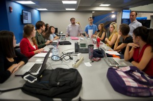 Matt Sheehan (center) works with a team of journalism students in the Innovation News Center during the 2012 presidential election.