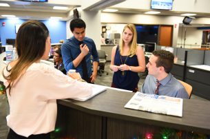 Students in the Innovation News Center.