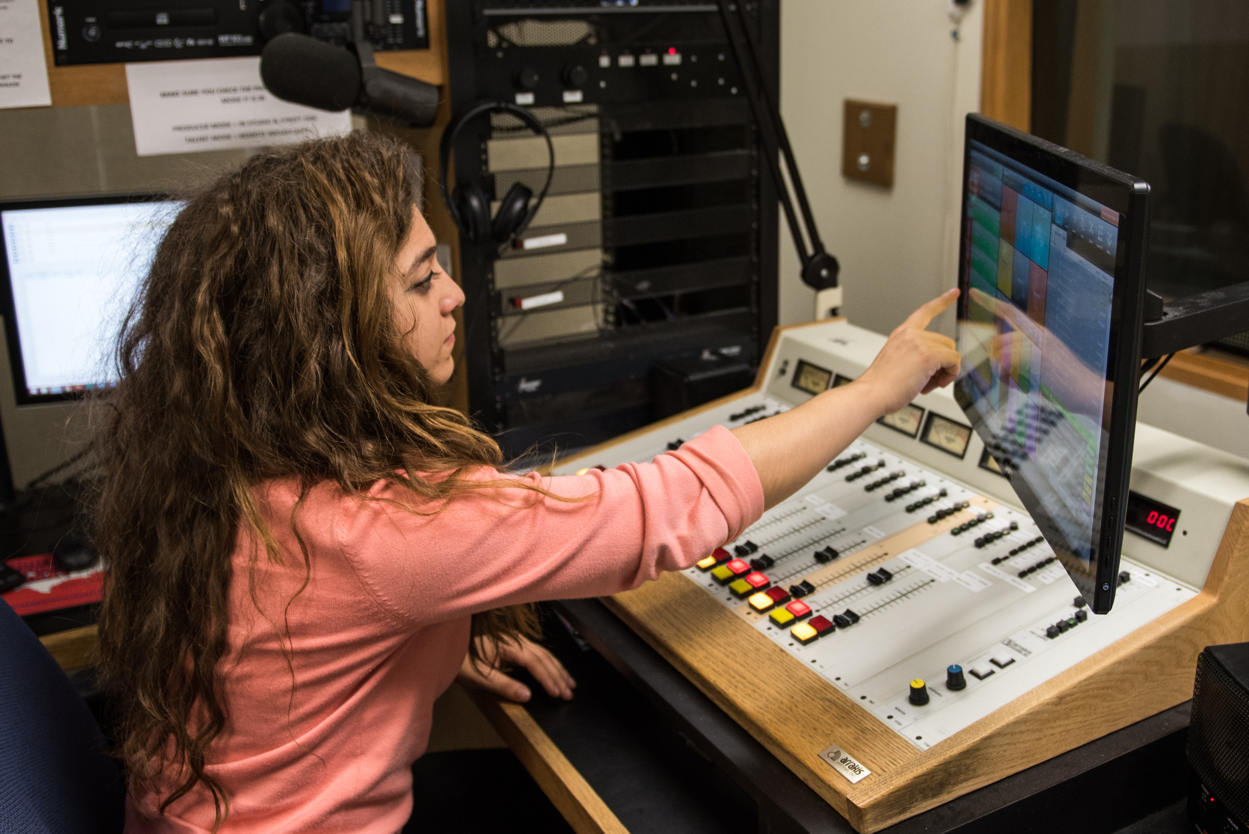 Student in radio master control.