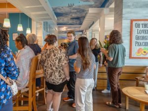 Attendees chat during the summer institute welcome reception. Photo credit: Jenna Ayoub.
