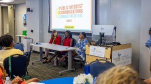Closing session panelist Charity Johnson speaks while fellow panelists Marrianne McMullen and Quiana Pinckney listen. Photo credit: Jenna Ayoub.