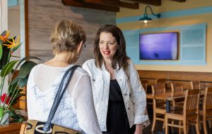 At the summer institute welcome reception, Angela Bradbery chats with Abbigail Tumpey. Photo credit: Jenna Ayoub.
