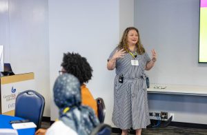 Erin Hart talks during a session on public interest communications concepts and frameworks. Photo credit: Jenna Ayoub.