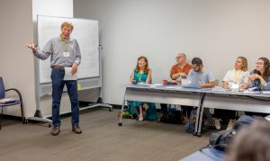 Glen Nowak presents information during a session about crisis communications in public health. Photo credit: Jenna Ayoub.