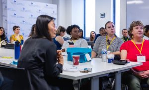 Attendees listen during a session. Photo credit: Jenna Ayoub.