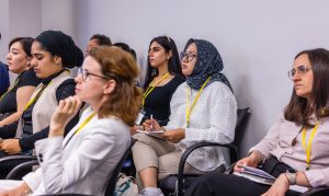Attendees listen during a session. Photo credit: Jenna Ayoub.