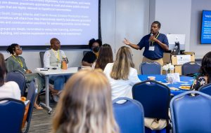 Antoine Haywood presents information during a session on grassroots approaches to social change. Photo credit: Jenna Ayoub.