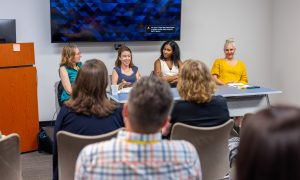 Holley Wilken, Yana Manyuk, Soroya Julian McFarlane and Emily Staub lead a session on approaches to reducing public health disparities. Photo credit: Jenna Ayoub.