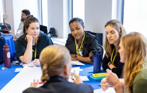 Attendees engage with each other during a session. Photo credit: Jenna Ayoub.