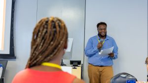 Facilitator Kevin Hardges speaks during the closing session. Photo credit: Jenna Ayoub.
