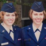 Keri and Kelsey Matwick dressed in navy-blue military uniforms.