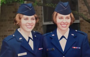 Keri and Kelsey Matwick dressed in navy-blue military uniforms.