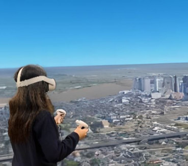 A woman wearing a VR headset with the view from inside the headset, a city skyline, visible behind her.