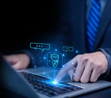 Businessman chatting with AI or artificial intelligence technology.