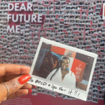 A Polaroid photo held in a hand.