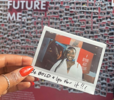 A Polaroid photo held in a hand.