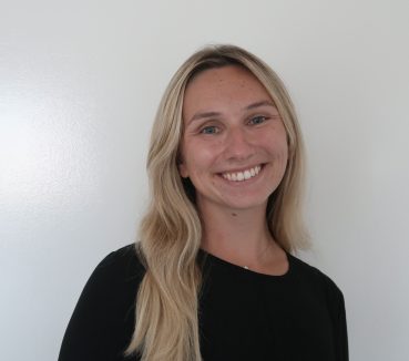Head shot photo of Journalism Assistant Professor Mia Carbone