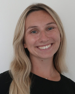 Head shot photo of Journalism Assistant Professor Mia Carbone
