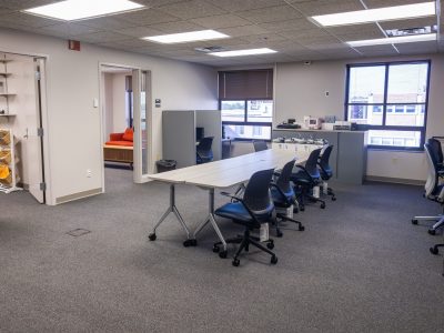 A view of the lab meeting rooms, meeting table and equipment.