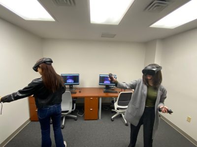 Students working with virtual reality headsets.