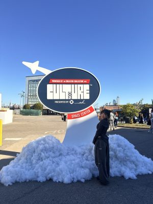 Woman standing in front of a CultureCon sign.